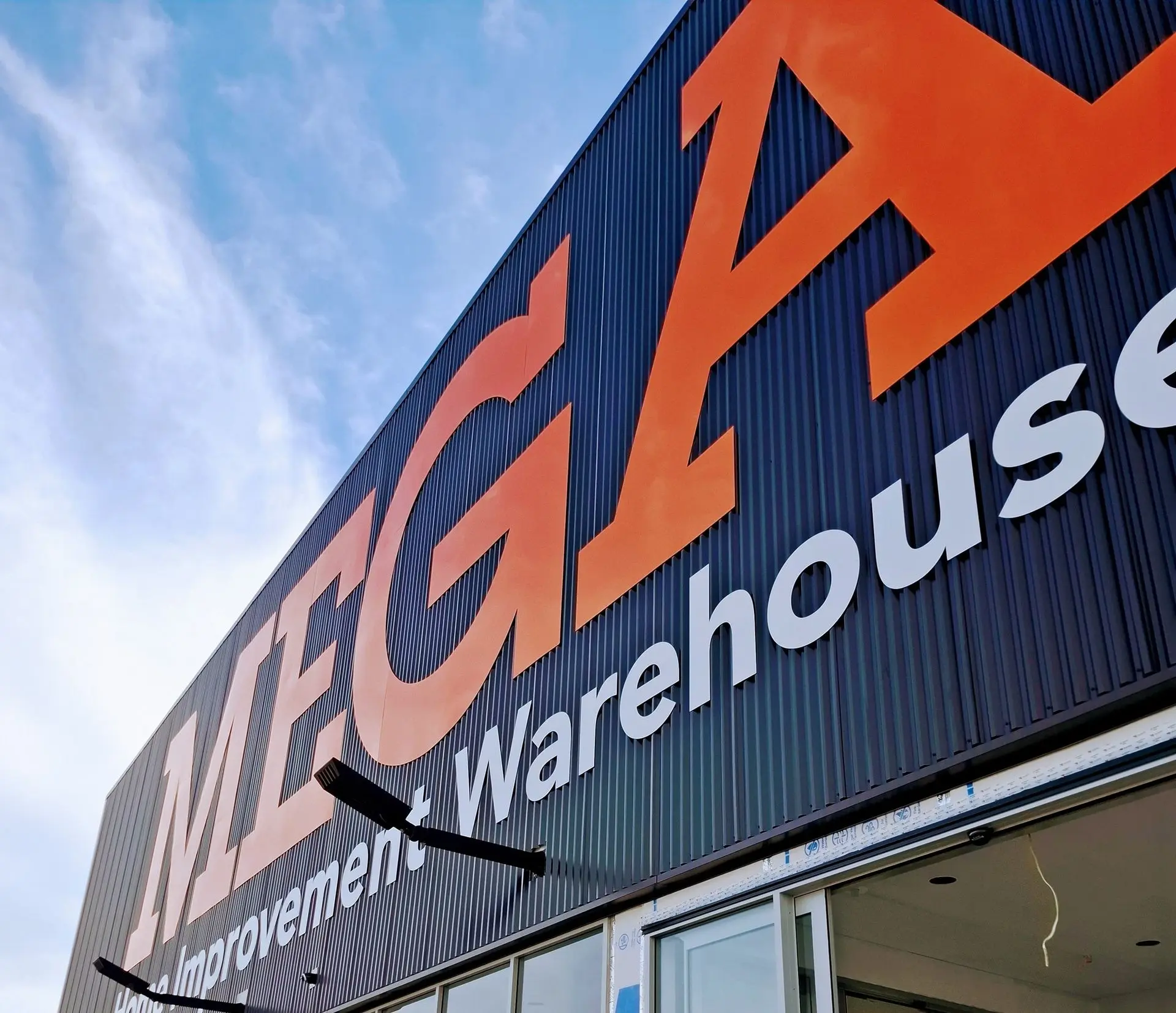 Large-scale outdoor building signage for mitre 10 mega.