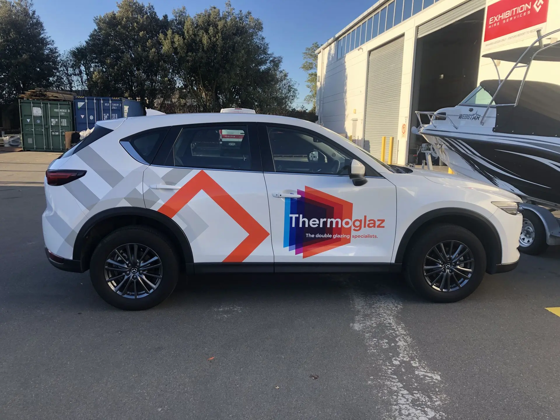 Impactful car wrap for Thermoglaz - with logo and brand graphics on a Mazda CX5
