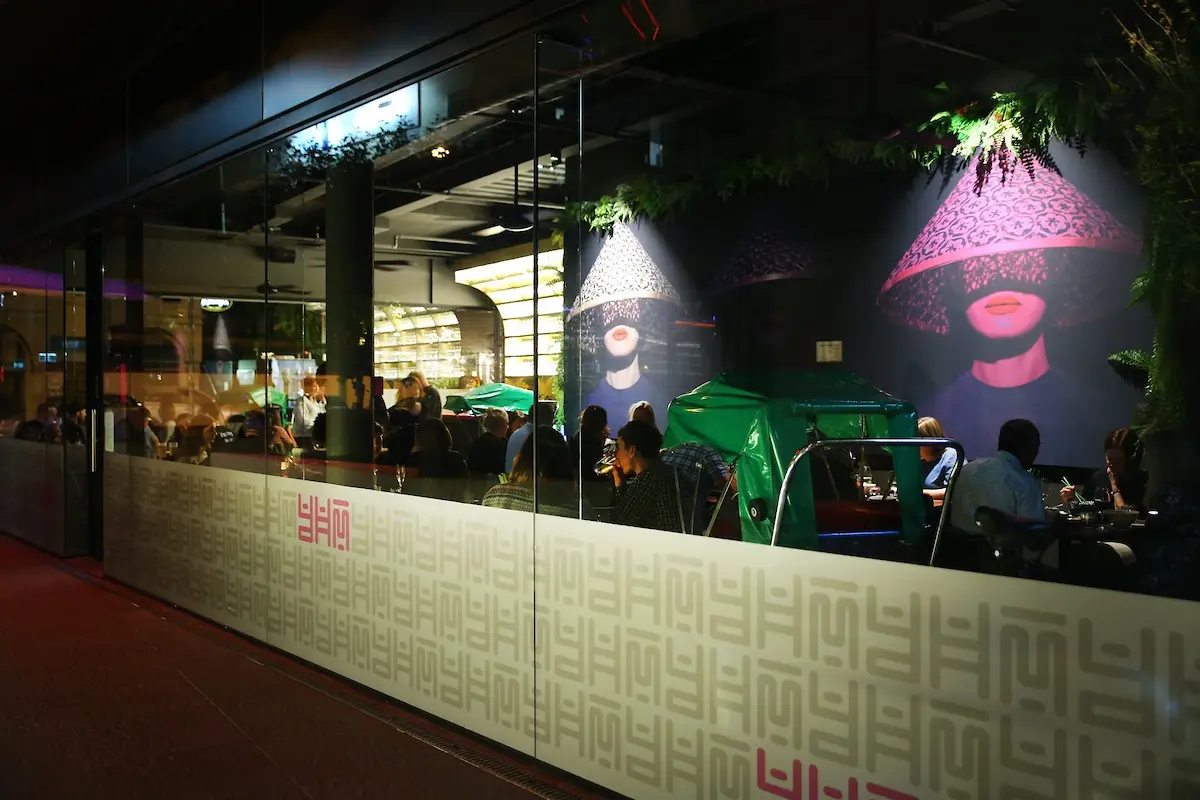 Floor to ceiling wall graphic creates a cosy atmosphere for restaurant branding at You Hanoi Me.