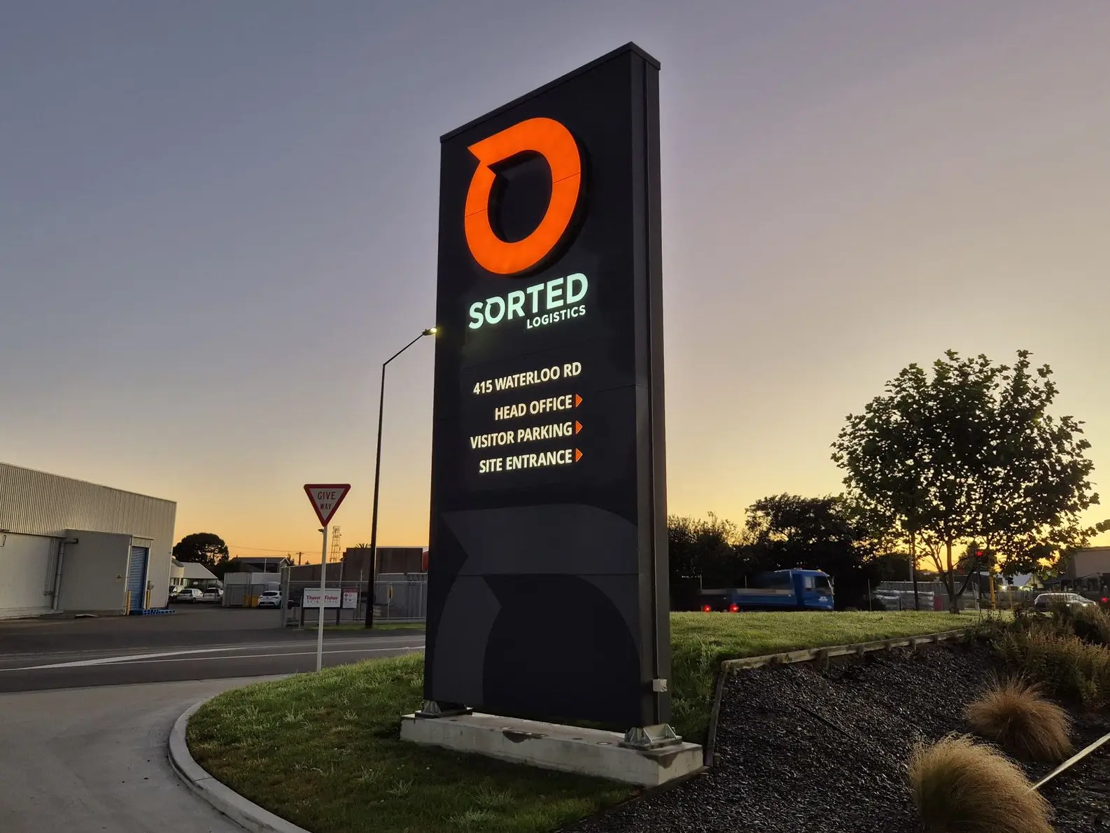 Illuminated pylon signage stands out on busy industrial sites and helps direct traffic at all hours. This Sorted Logistics Pylon features the logo and lit up directional signage.