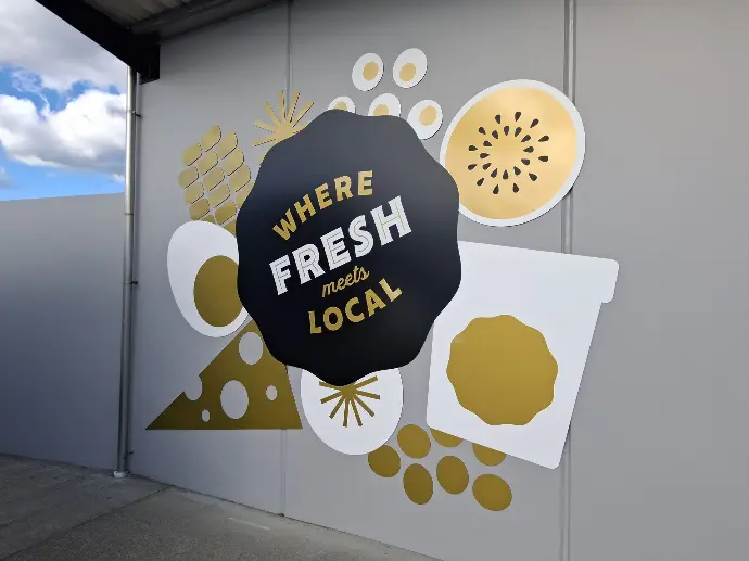 Exterior promotional signage for Fresh Choice Supermarkets