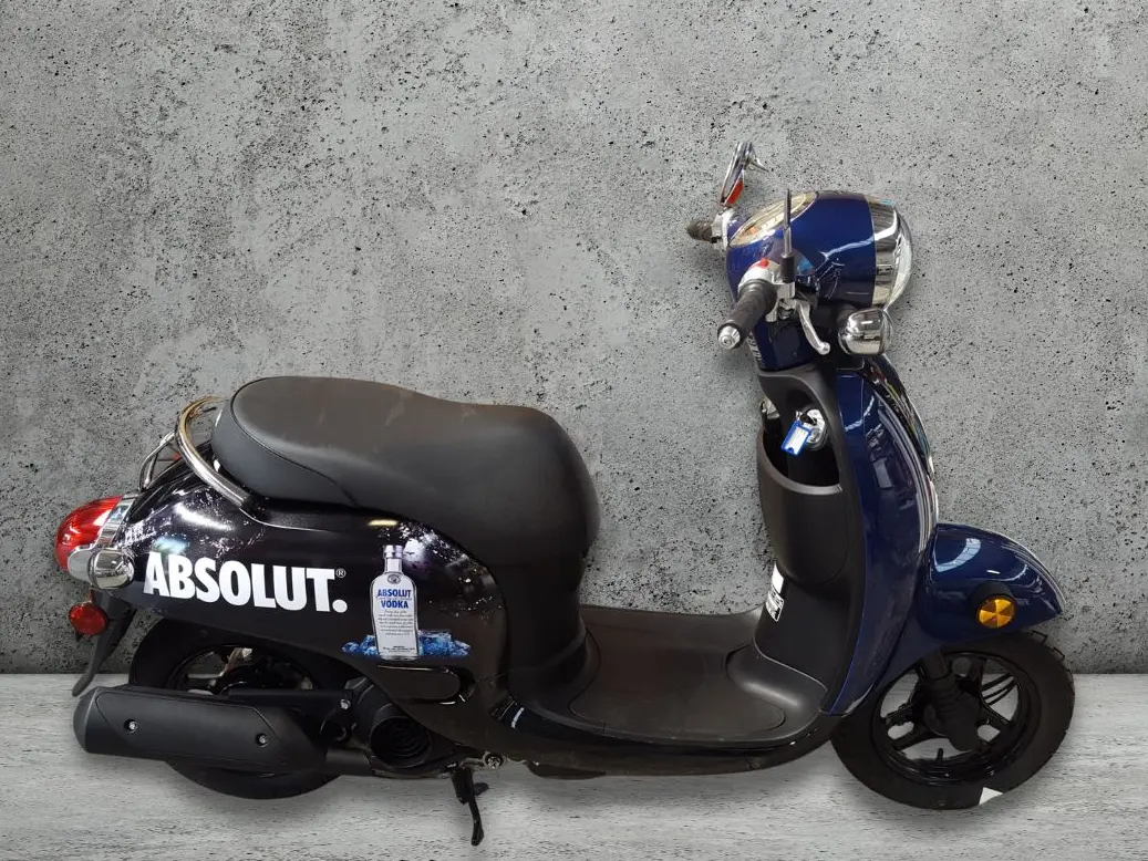 Promotional graphics for a moped motorbike with logo and graphics.