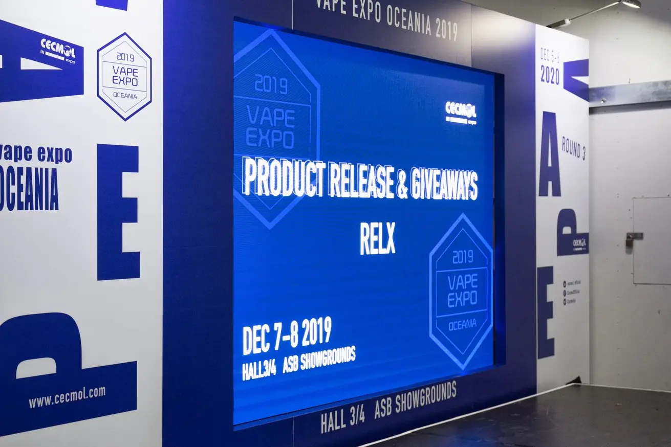 LED Screen embedded in exhibition wall behind a presentation stage