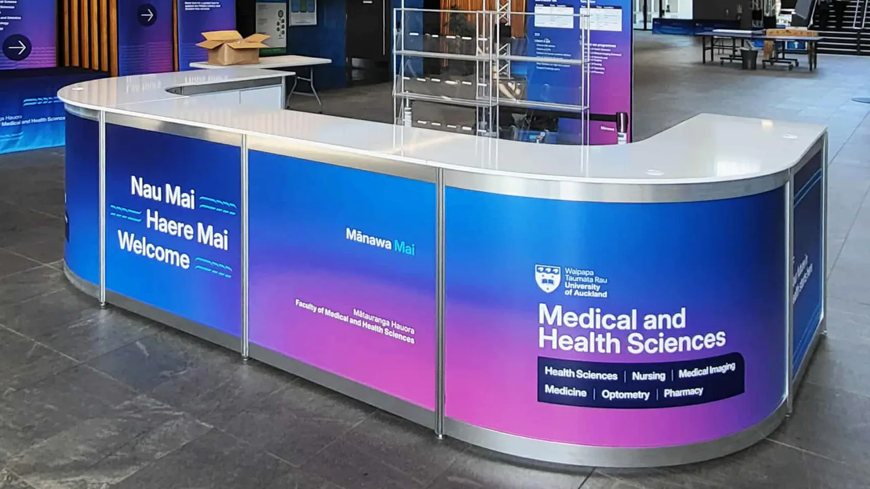 A custom branded exhibition counter and banners for Medical and Health Sciences.