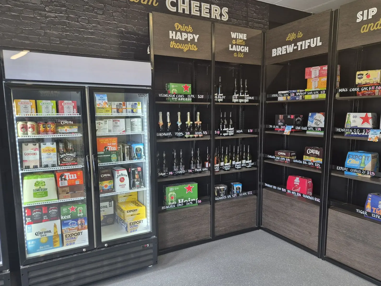 Custom wall panelling and shelving with branded categories for a local liquor store interior fit out.