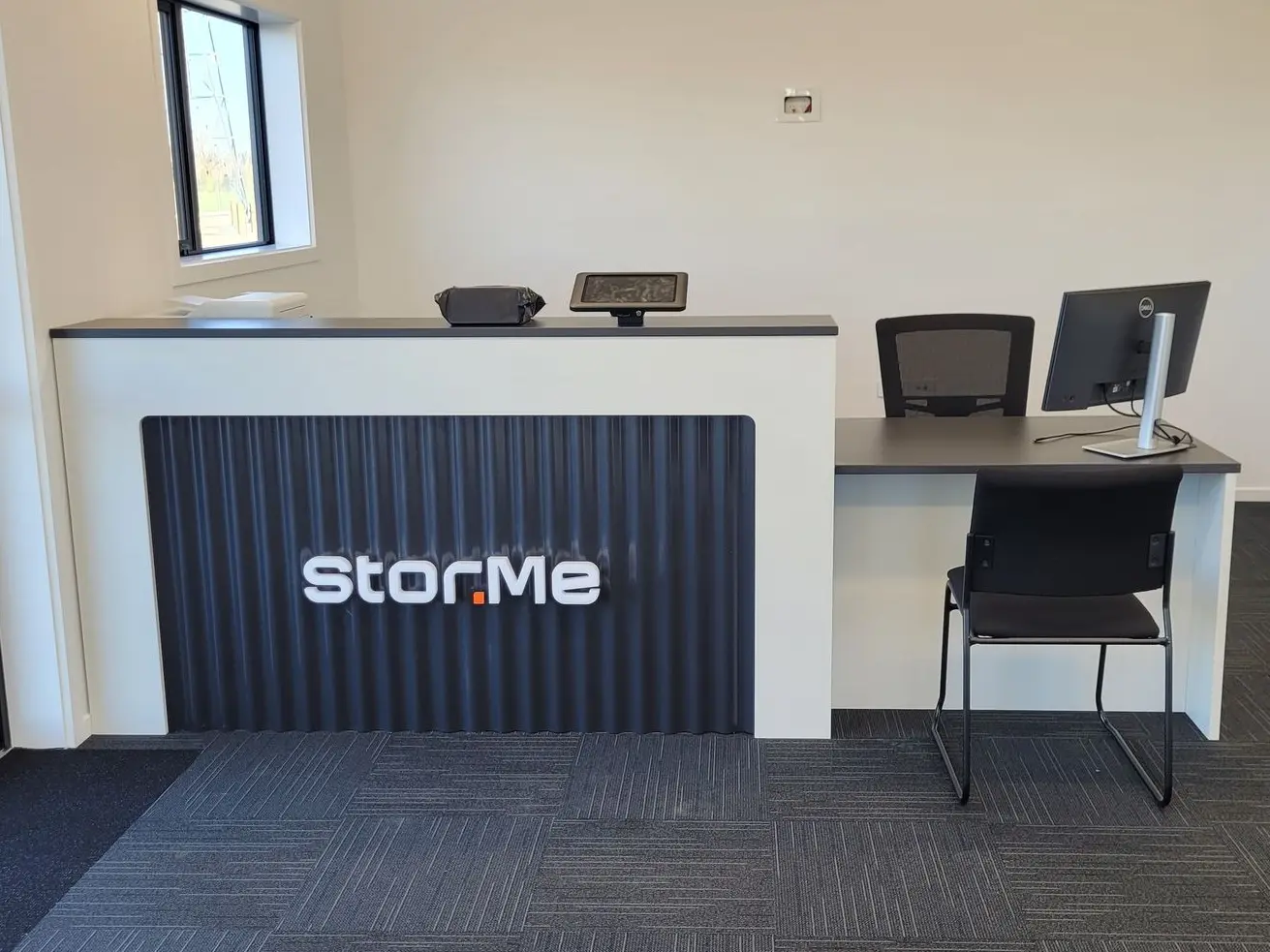 This reception area features a custom designed desk fit out, with a 3D cut illuminated brand attached to the desk for an impactful first statement.