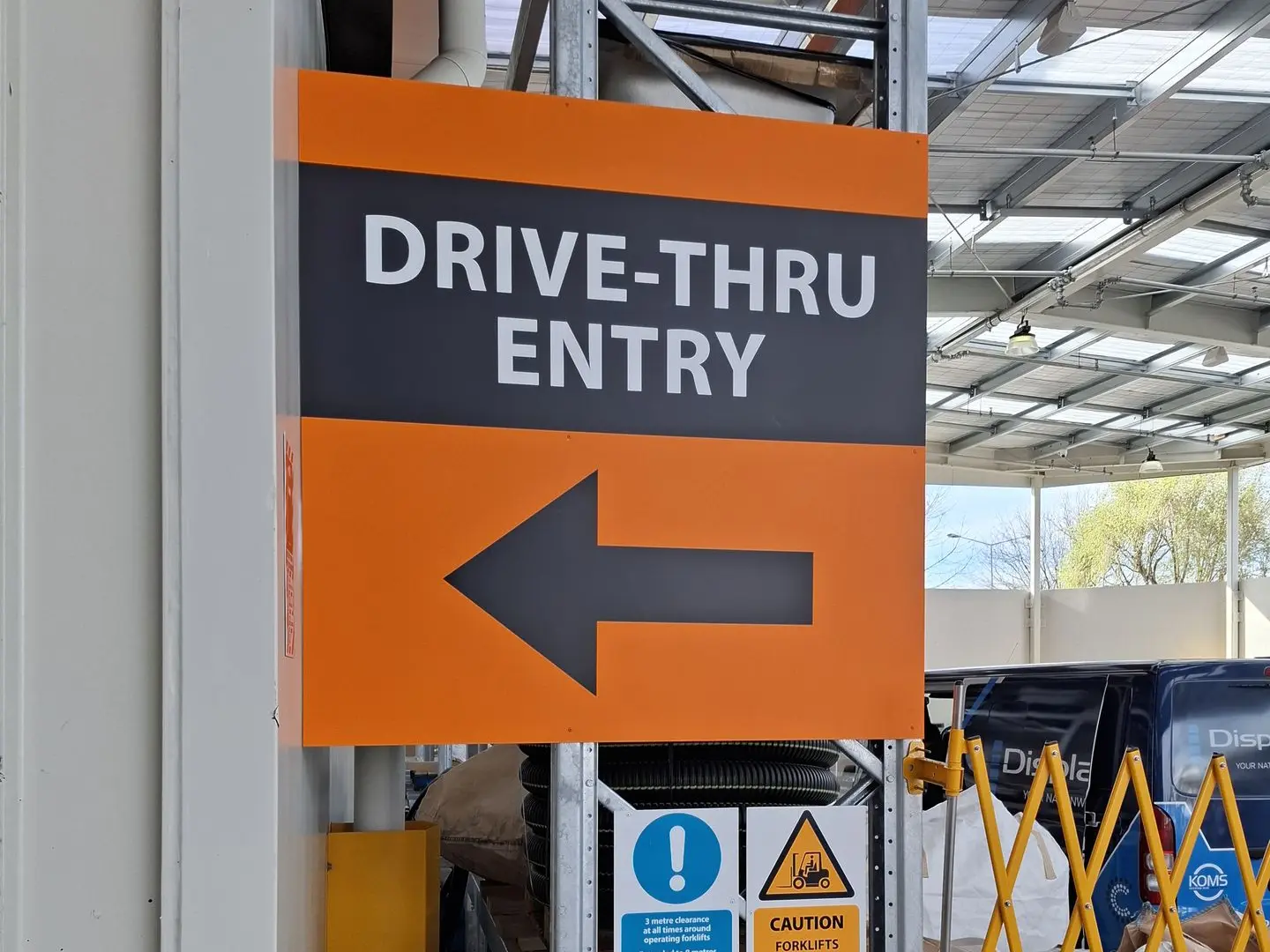 Wayfinding signage for Mitre10 Mega pick up zones, directing customers through the space safely