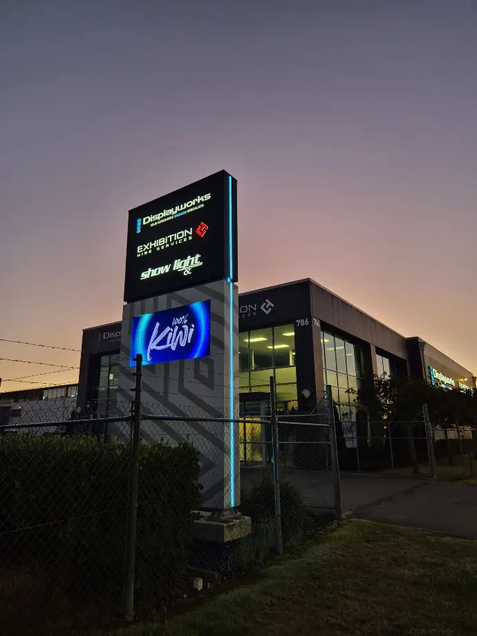 Roadside pylon featuring a digital LED screen and illuminated logos for a business in Christchurch