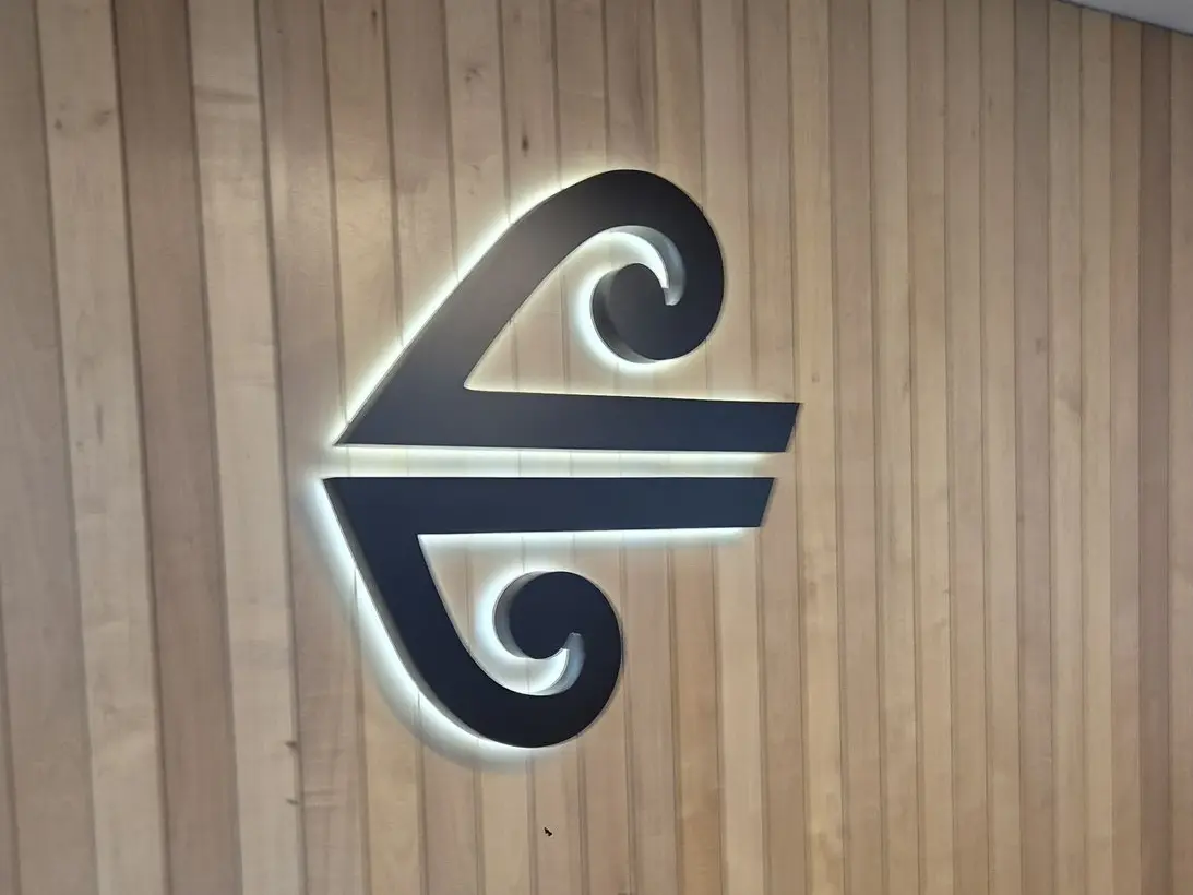 Halo lit brand logo for Air New Zealand signage on wall of Koru lounge, halo lit illuminated sign by Displayworks