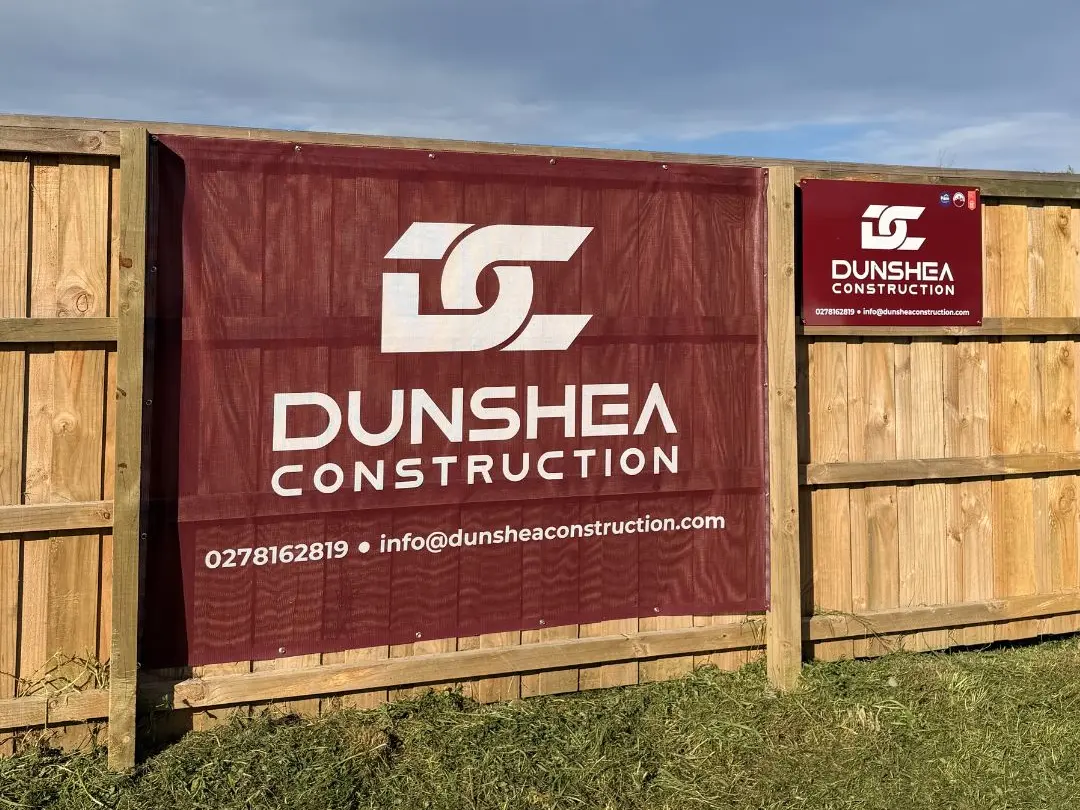 Branded Fence Mesh Scrim and ACM signage for Dunshea Construction, a Christchurch Builder.