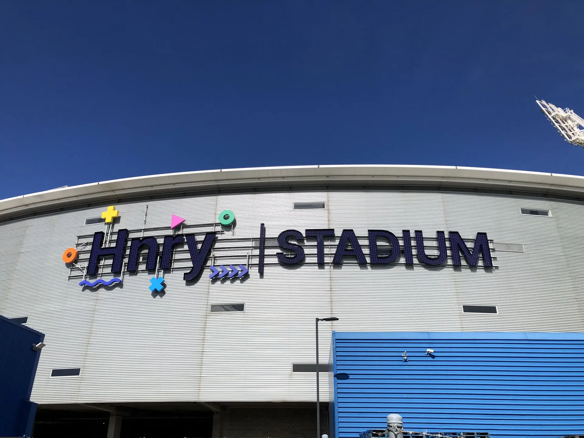 Image shows the new HNRY stadium logo - designed to shine purple during the day and light up at night for round the clock visibility.